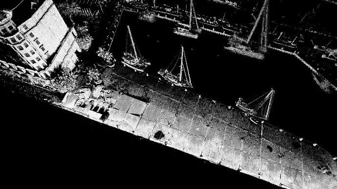 Intensity-shaded LiDAR point cloud of a quay viewed from above, with individual points clearly resolvable on the deck surface
